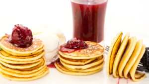 Pancakes**: Soft, well-cooked pancakes with a compote or syrup on top